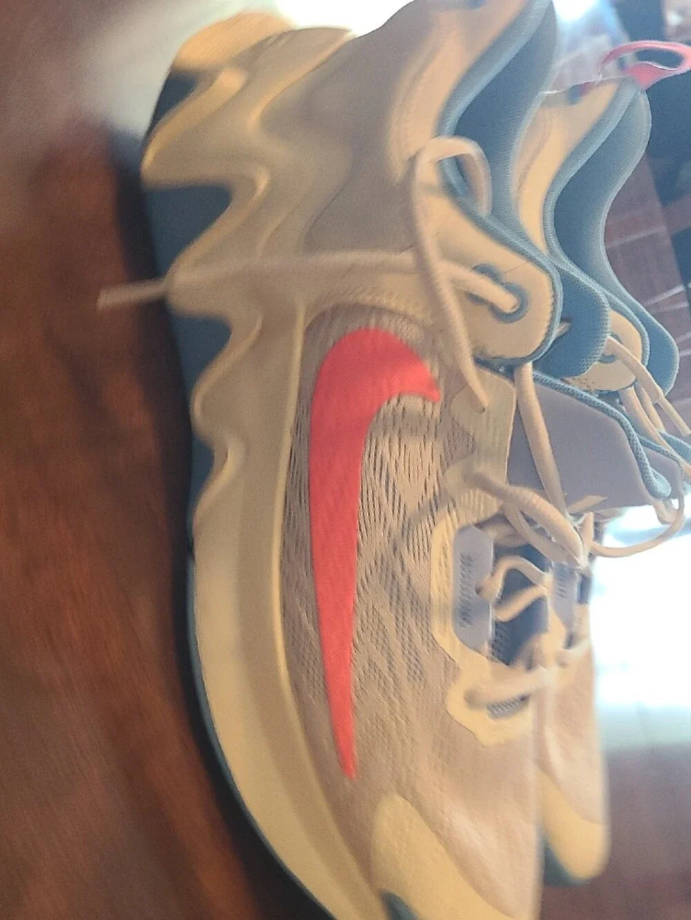 Nike White Sneakers with Light Blue Soles and Coral Swoosh DM0825-103